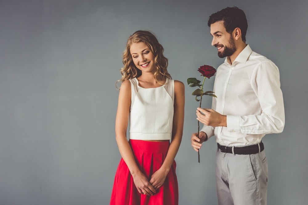 man give rose to girl